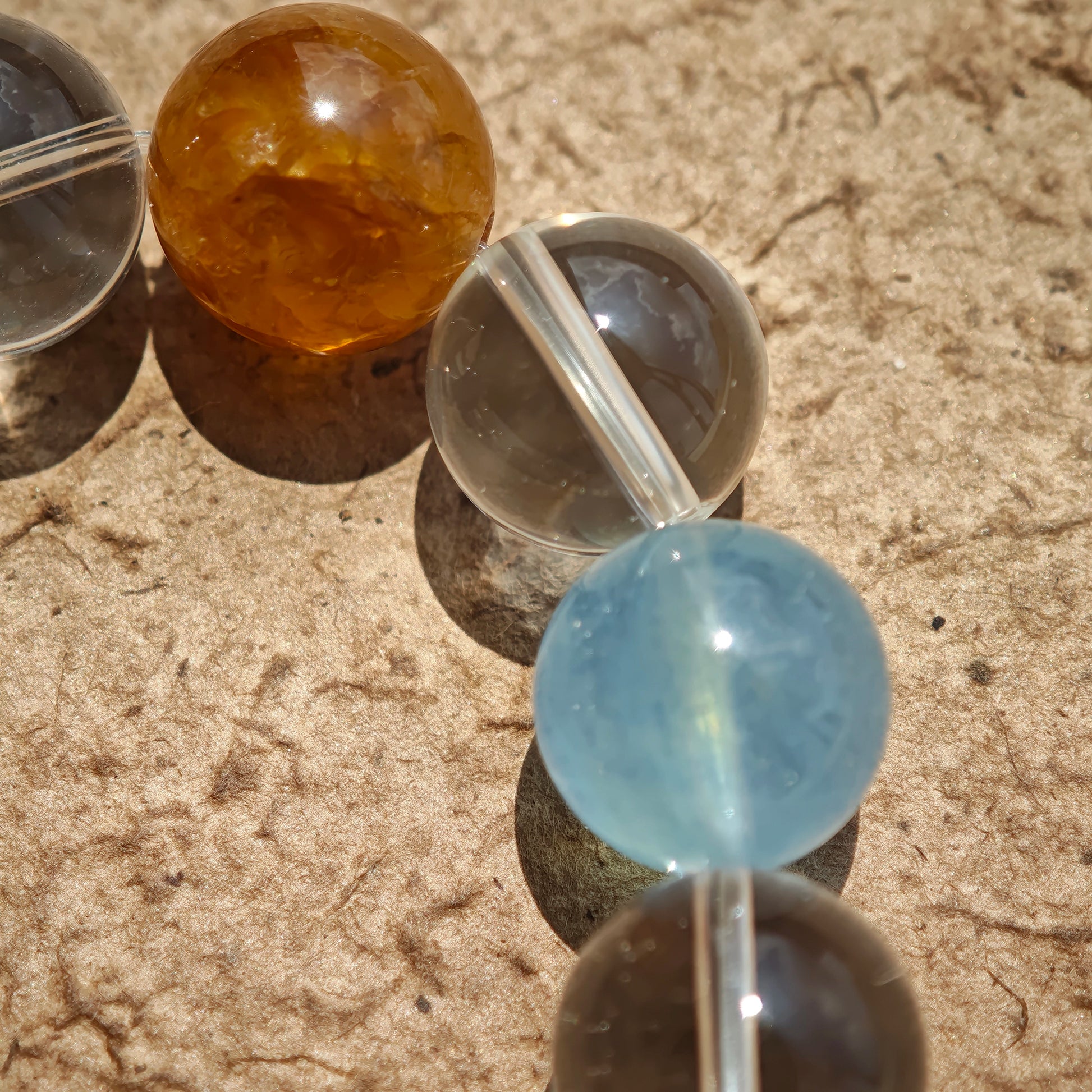 This exquisite piece features a curated blend of genuine crystals—from passionate Strawberry Quartz and tranquil Amethyst to the amplifying Clear Quartz—each selected for its unique beauty and energetic properties.