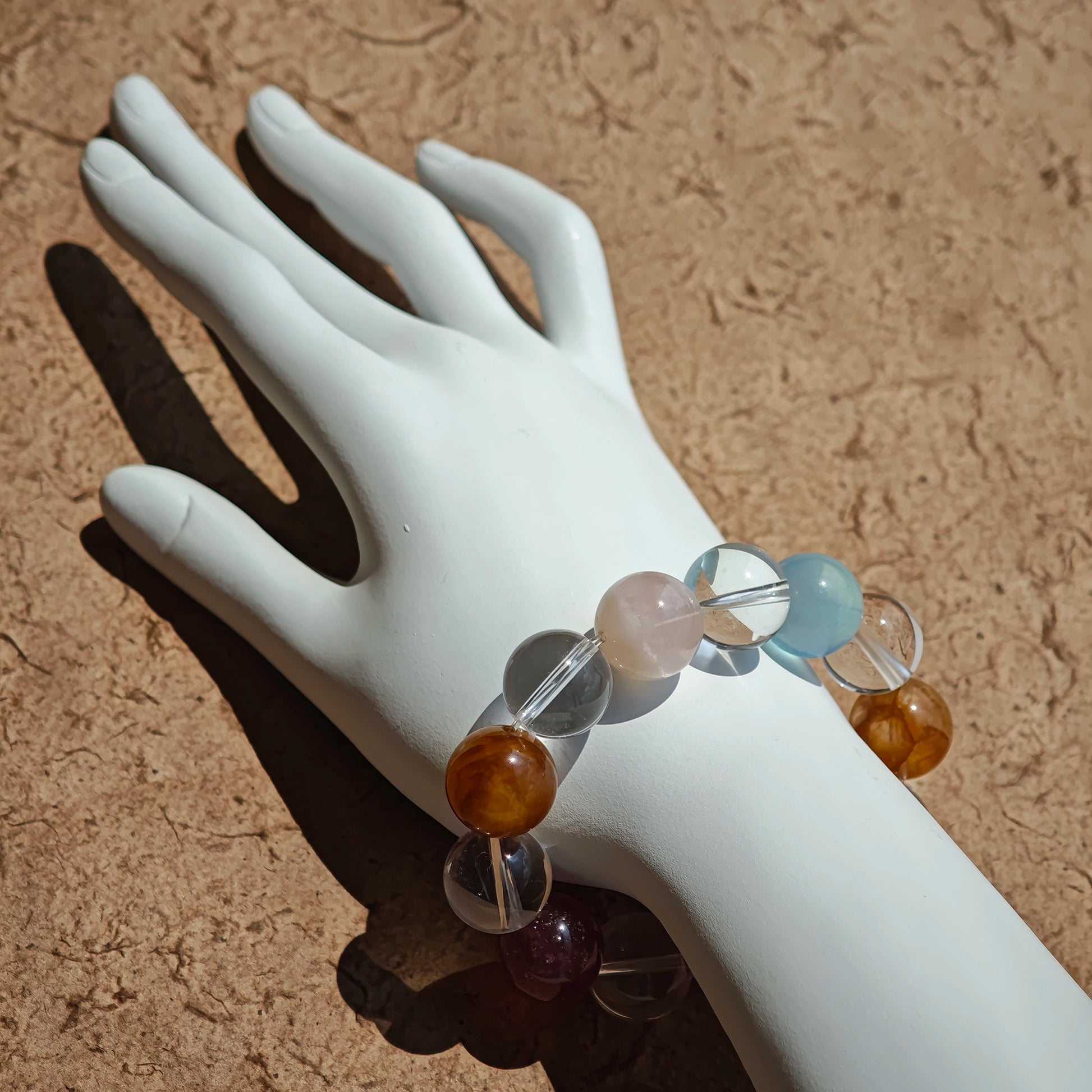 This exquisite piece features a curated blend of genuine crystals—from passionate Strawberry Quartz and tranquil Amethyst to the amplifying Clear Quartz—each selected for its unique beauty and energetic properties.
