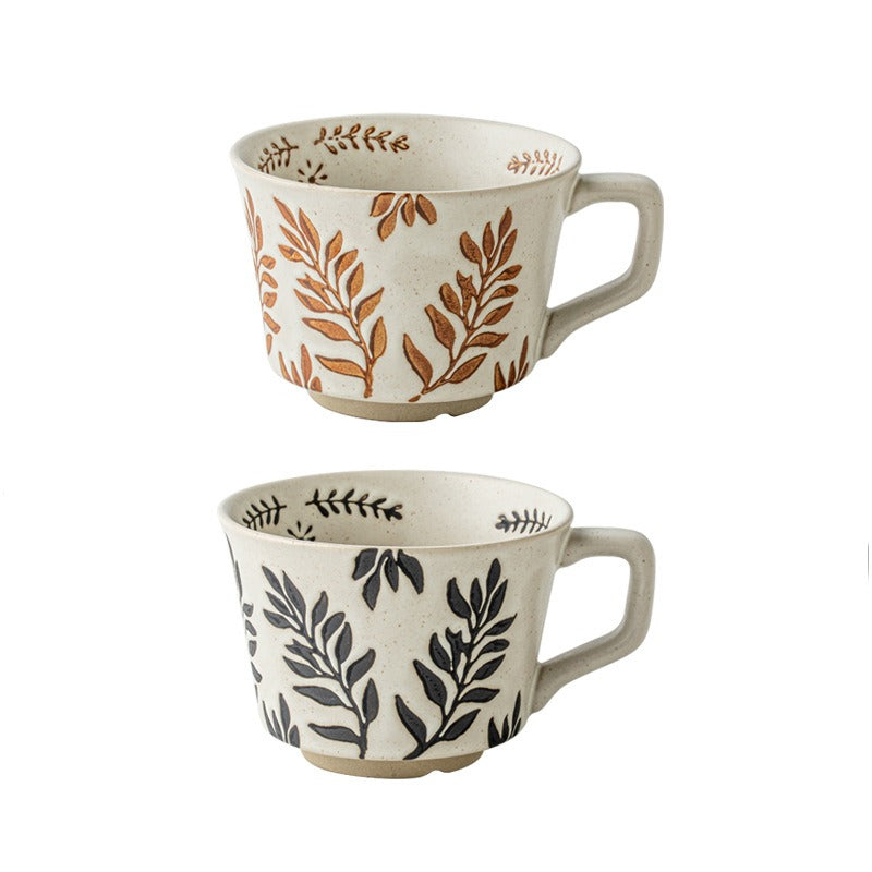 This is a 325ml coarse ceramic mug with a matte sesame-speckled glaze and hand-painted leaf design. It comes with a rounded handle that sits comfortably in your hand. Ideal for coffee, milk, water, or oatmeal during slow mornings or quiet afternoons.