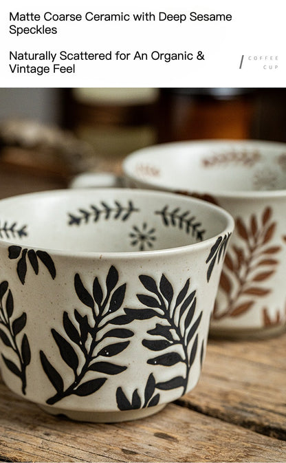 This is a 325ml coarse ceramic mug with a matte sesame-speckled glaze and hand-painted leaf design. It comes with a rounded handle that sits comfortably in your hand. Ideal for coffee, milk, water, or oatmeal during slow mornings or quiet afternoons.