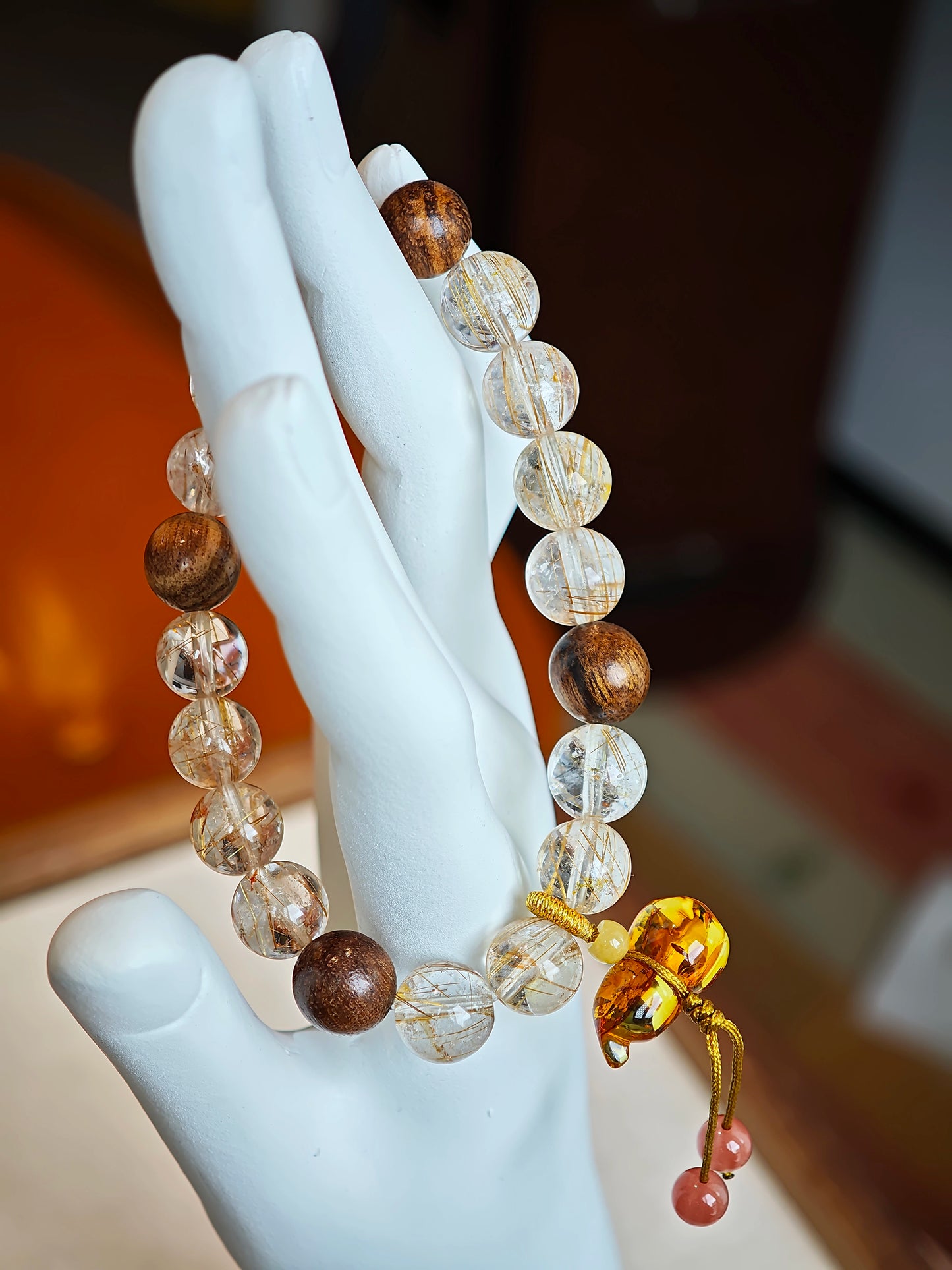 Crystals full of copper sunbeams rest on agarwood clouds, then descend into a Nanhong flower-gourd of guardianship.