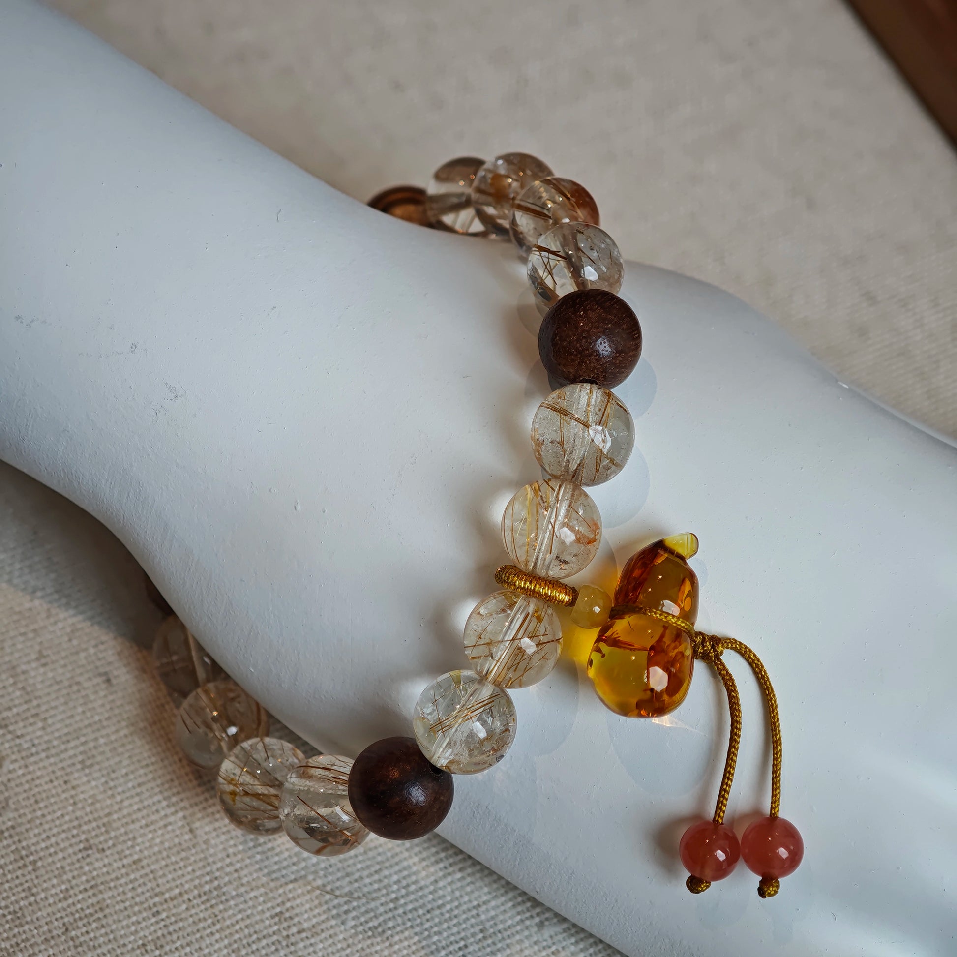 Wear solar threads, smell forest time, carry a carved amber bud that doubles as fortress and fortune cookie.