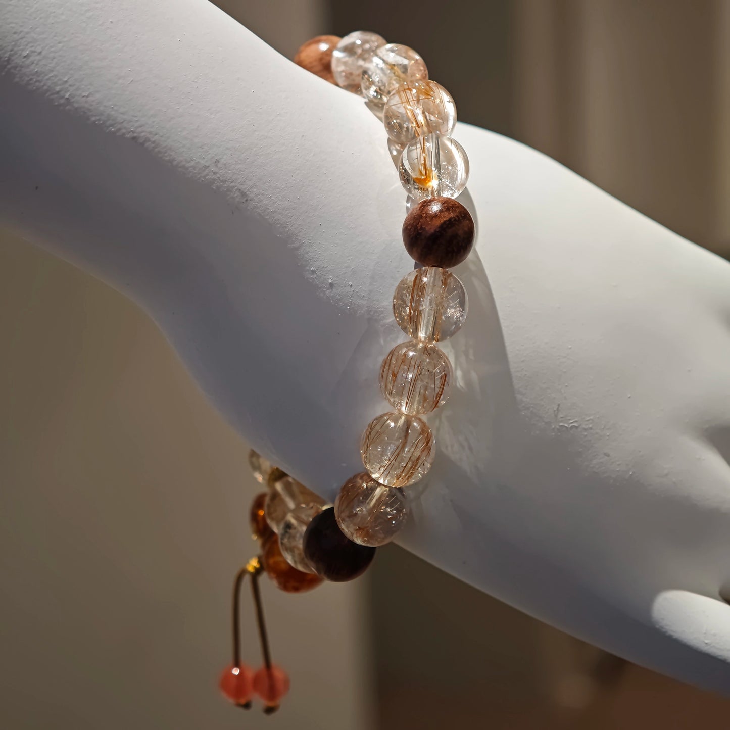 Each copper-rutilated bead is a spark; every agarwood bead a breath; the floral calabash, a guardian petal of prosperity.