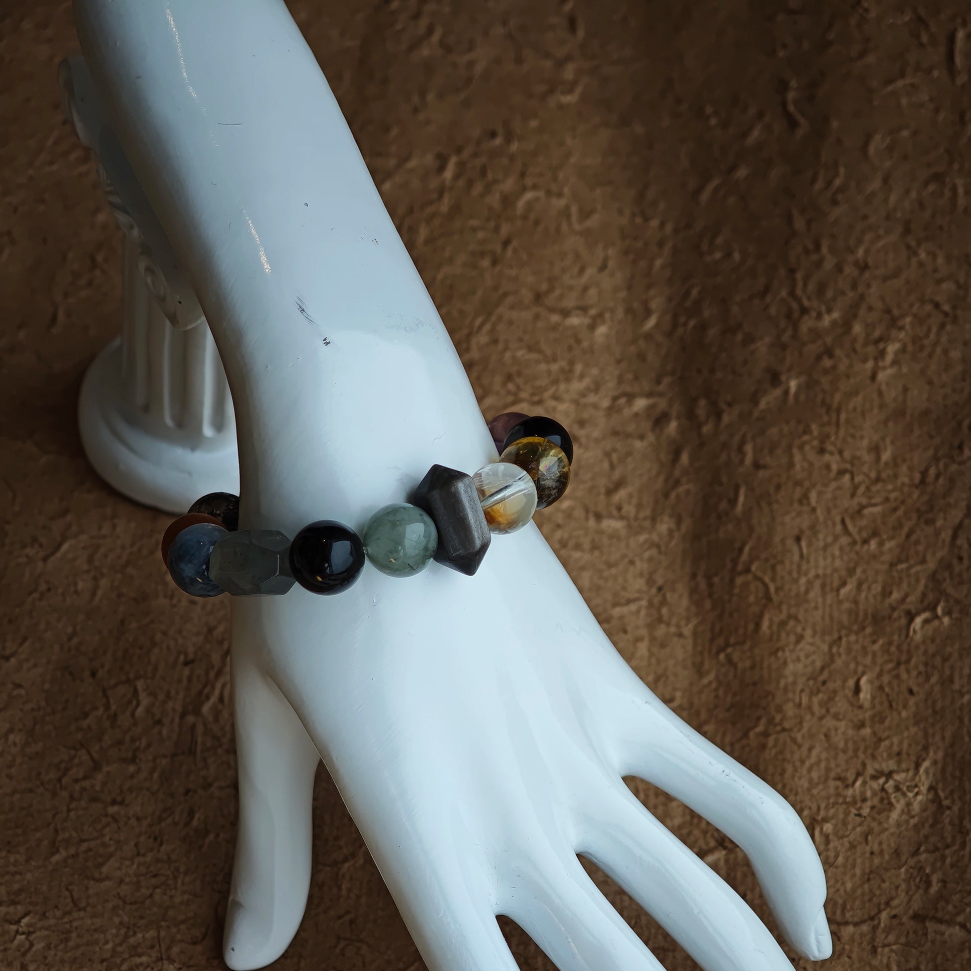 Dress up or down with a bracelet that fuses rutile, phantom, citrine, amethyst, moonstone and silver obsidian in icy harmony.