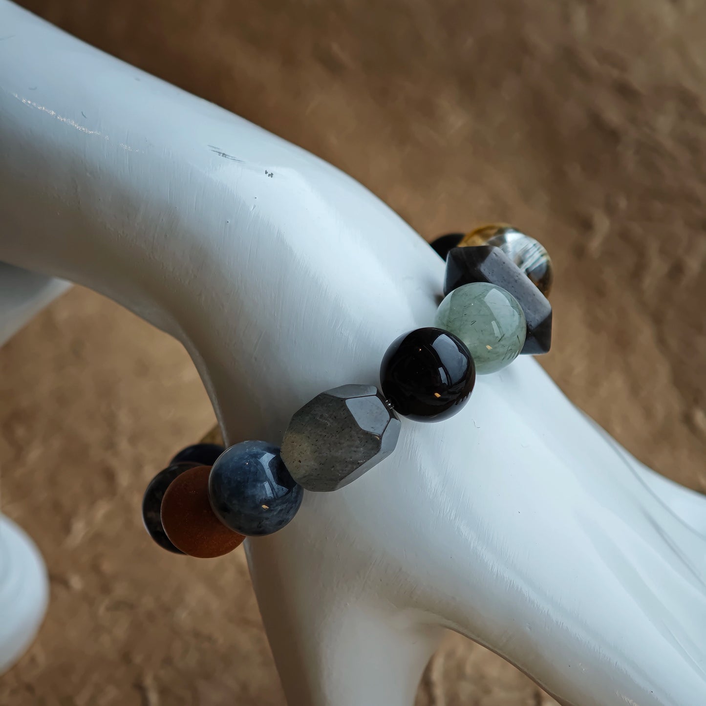 Quietly powerful: rutilated quartz, white phantom, citrine, amethyst, moonstone and silver obsidian form a mysterious palette.