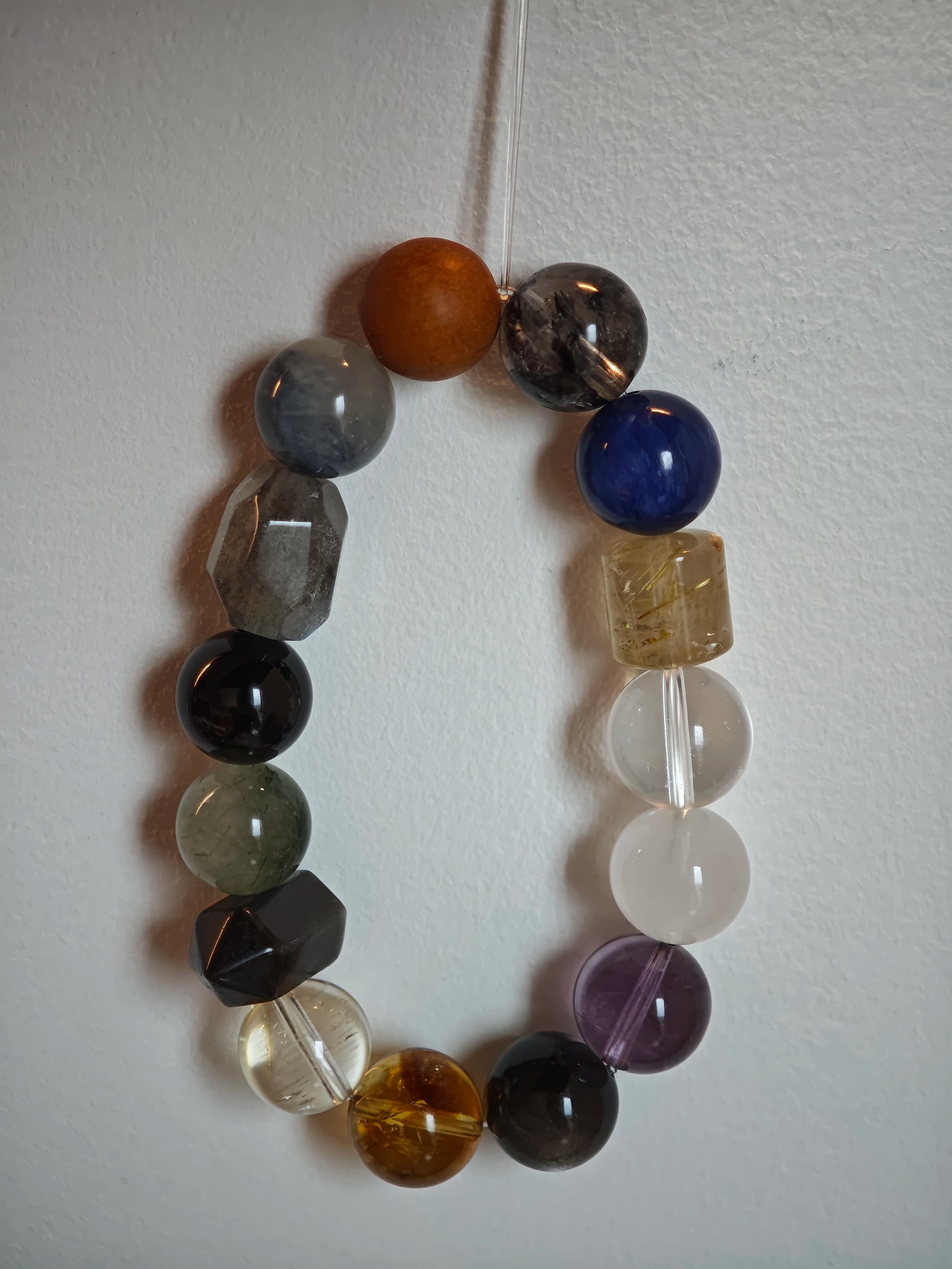 Sharp yet soft: rutile needles, phantom clouds, citrine warmth, amethyst depth, moonstone mist and obsidian mirror.