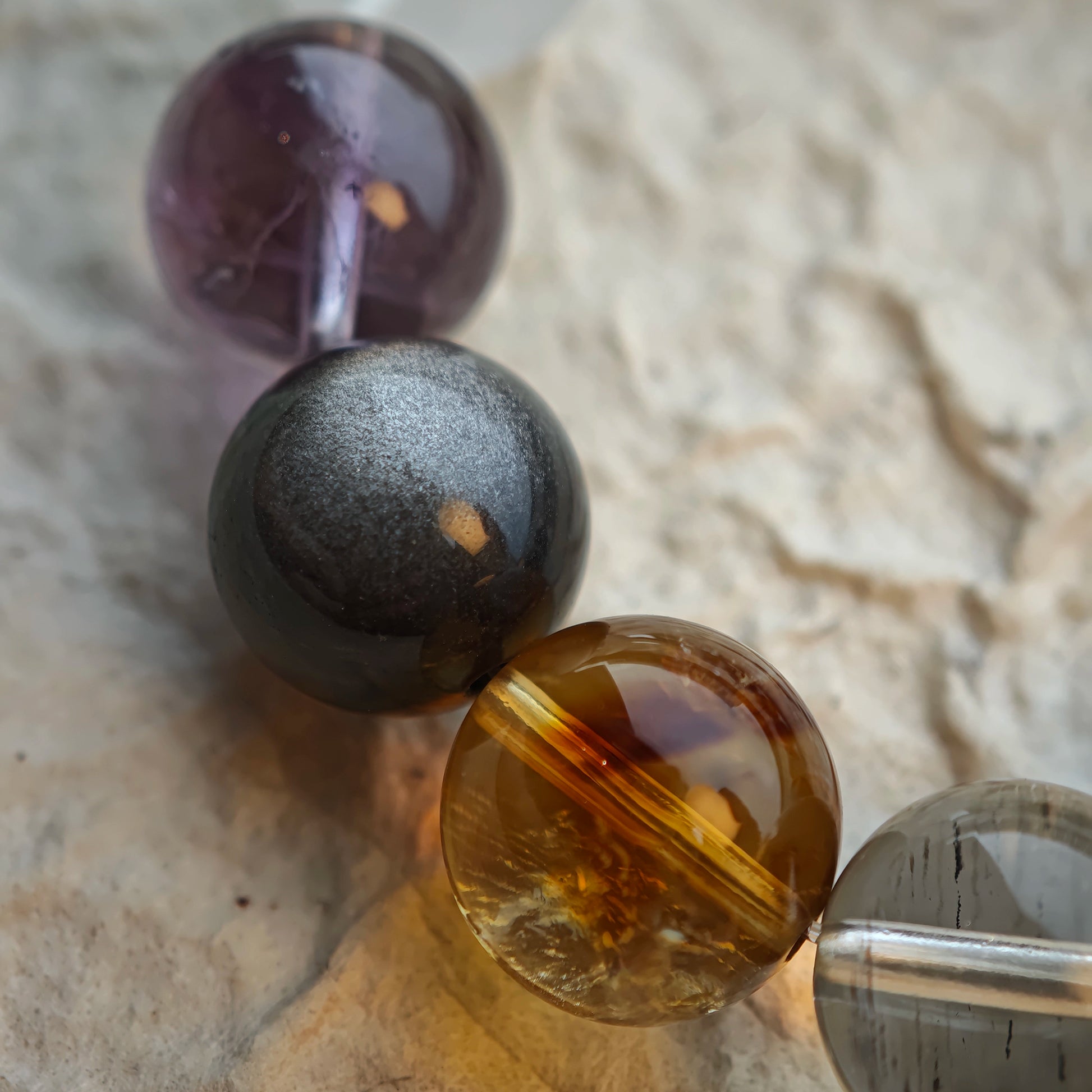 Rutile sparks, phantom veils, citrine sun, amethyst dusk, moonstone glow and obsidian shield—one sleek, cold-hued circle.