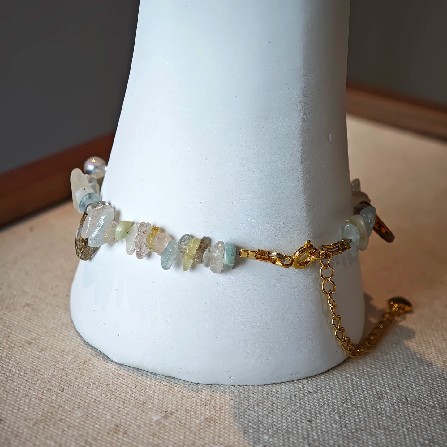 Consist of milky white and pale blue glass beads and shimmering crystal fragments, this beaded bracelet glows like sunlight dancing on icy shores.