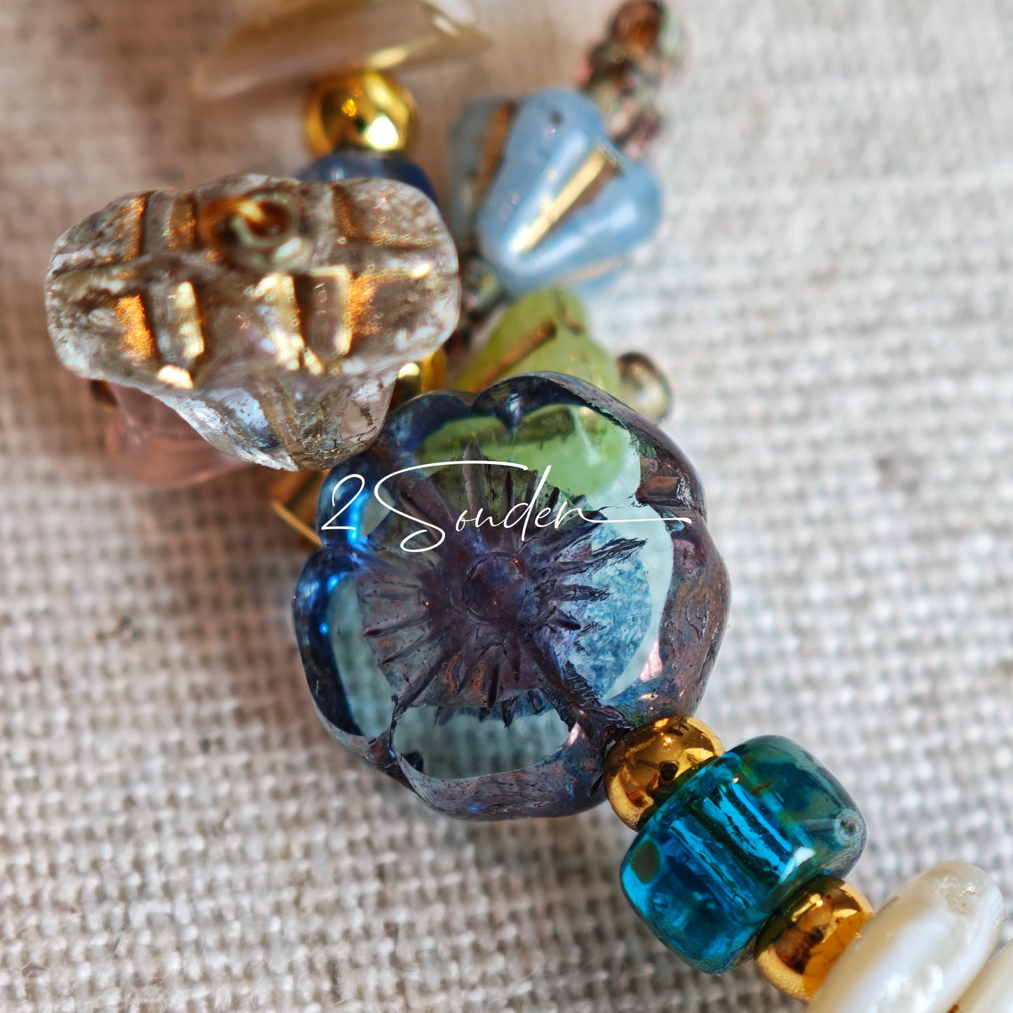 This is a bag charm that made of Czech beads. In the phone strap, there are different spacers like orange, leaves, flowers and lemon. It's with multi colors. This bag charm can also be used as a phone strap and key chain.