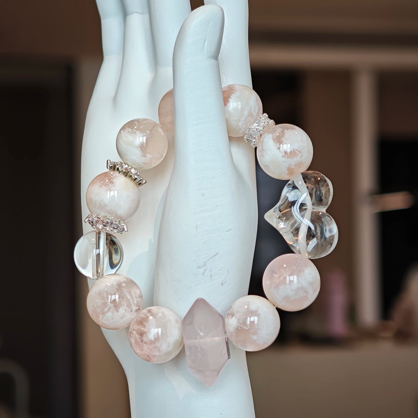 Milky phantom rose quartz swirl beside icy quartz, unlocking secret wishes with every flicker of light.