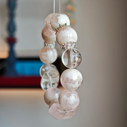 Soft-snow phantom rose quartz and pure clear quartz merge—like heartbeats meeting headlights on a winter road—guiding desire home.