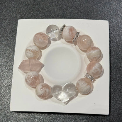 This blush-snow phantom rose quartz bracelet pairs soft power with crystal clarity to stir what your heart quietly craves.