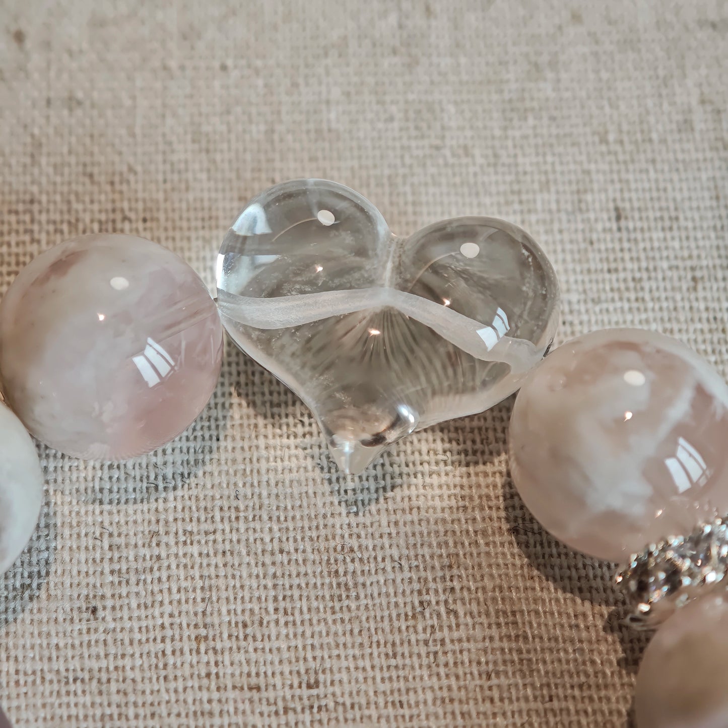 Let powder-pink phantom rose quartz dance with pure clear quartz, pointing your inner compass toward unspoken hopes.