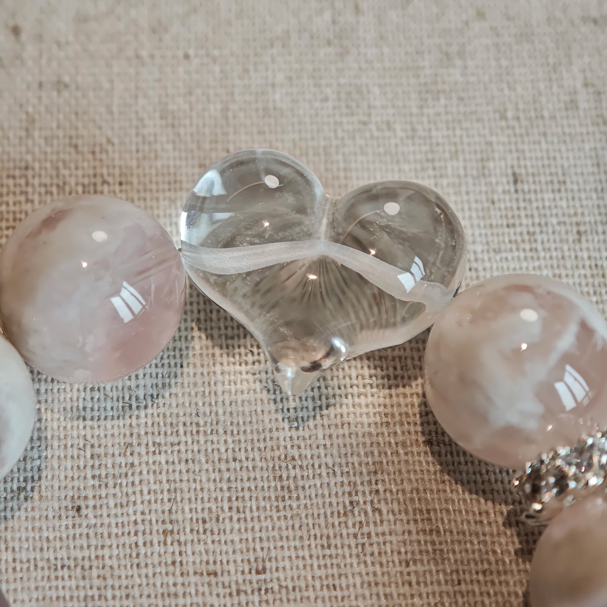Let powder-pink phantom rose quartz dance with pure clear quartz, pointing your inner compass toward unspoken hopes.