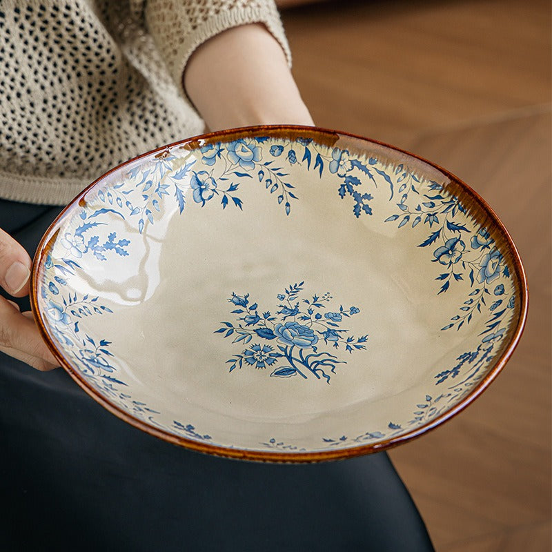 This is a 9-inch/23.5cm deep plate with blue lotus leaf patterns. The capacity is 920ml. And it's with wide and open shape. Crafted using a reactive "Kiln Change" glaze technique, each plate reacts differently to the high heat of the kiln.