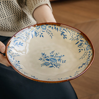 This is a 9-inch/23.5cm deep plate with blue lotus leaf patterns. The capacity is 920ml. And it's with wide and open shape. Crafted using a reactive "Kiln Change" glaze technique, each plate reacts differently to the high heat of the kiln.