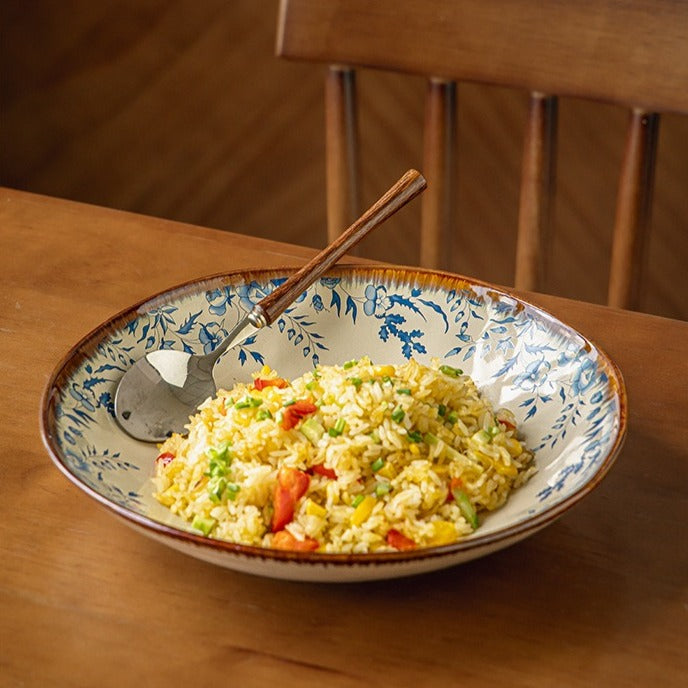 This is a 9-inch/23.5cm deep plate with blue lotus leaf patterns. The capacity is 920ml. And it's with wide and open shape. Crafted using a reactive "Kiln Change" glaze technique, each plate reacts differently to the high heat of the kiln.