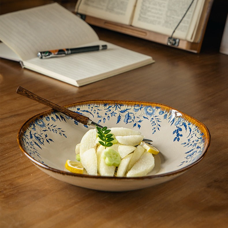 This is a 9-inch/23.5cm deep plate with blue lotus leaf patterns. The capacity is 920ml. And it's with wide and open shape. Crafted using a reactive "Kiln Change" glaze technique, each plate reacts differently to the high heat of the kiln.