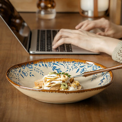 This is a 9-inch/23.5cm deep plate with blue lotus leaf patterns. The capacity is 920ml. And it's with wide and open shape. Crafted using a reactive "Kiln Change" glaze technique, each plate reacts differently to the high heat of the kiln.