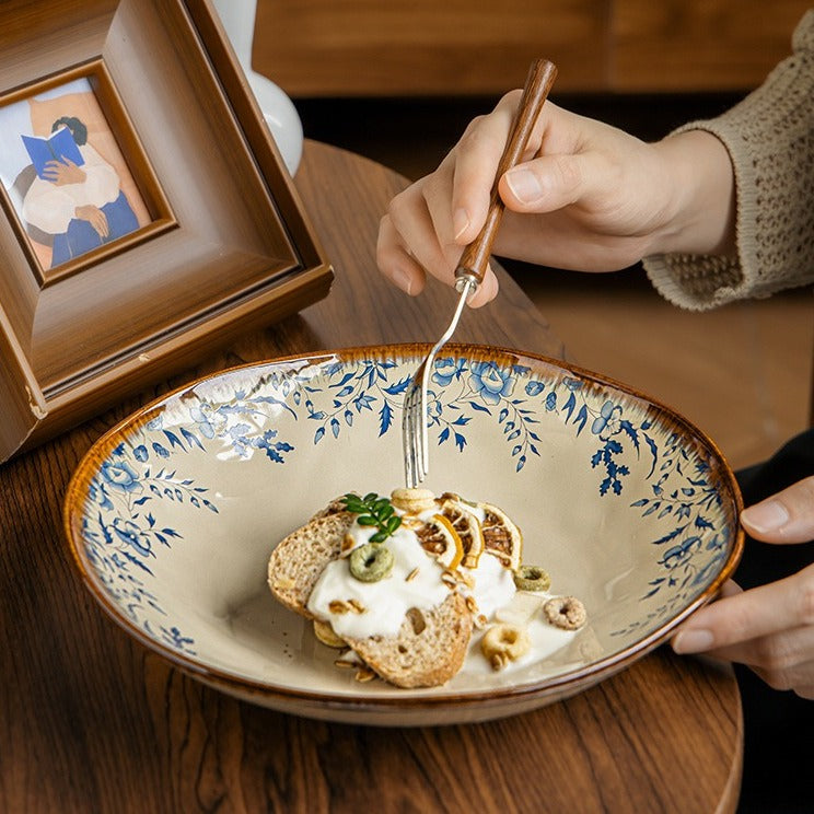 This is a 9-inch/23.5cm deep plate with blue lotus leaf patterns. The capacity is 920ml. And it's with wide and open shape. Crafted using a reactive "Kiln Change" glaze technique, each plate reacts differently to the high heat of the kiln.