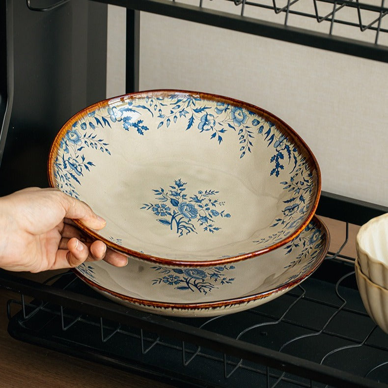 This is a 9-inch/23.5cm deep plate with blue lotus leaf patterns. The capacity is 920ml. And it's with wide and open shape. Crafted using a reactive "Kiln Change" glaze technique, each plate reacts differently to the high heat of the kiln.