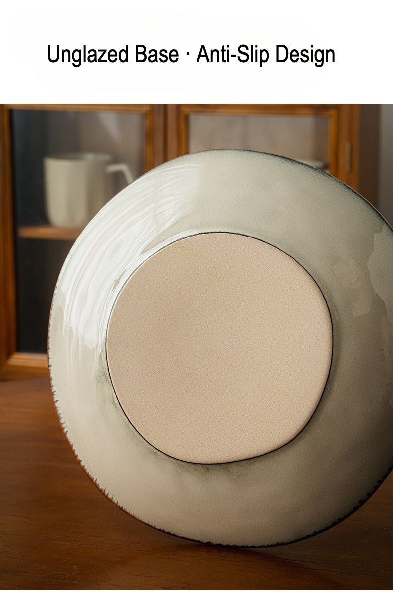 This is a 9-inch/23.5cm deep plate with blue lotus leaf patterns. The capacity is 920ml. And it's with wide and open shape. Crafted using a reactive "Kiln Change" glaze technique, each plate reacts differently to the high heat of the kiln.