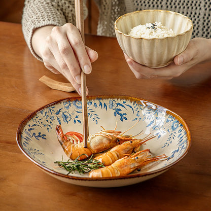 This is a 9-inch/23.5cm deep plate with blue lotus leaf patterns. The capacity is 920ml. And it's with wide and open shape. Crafted using a reactive "Kiln Change" glaze technique, each plate reacts differently to the high heat of the kiln.