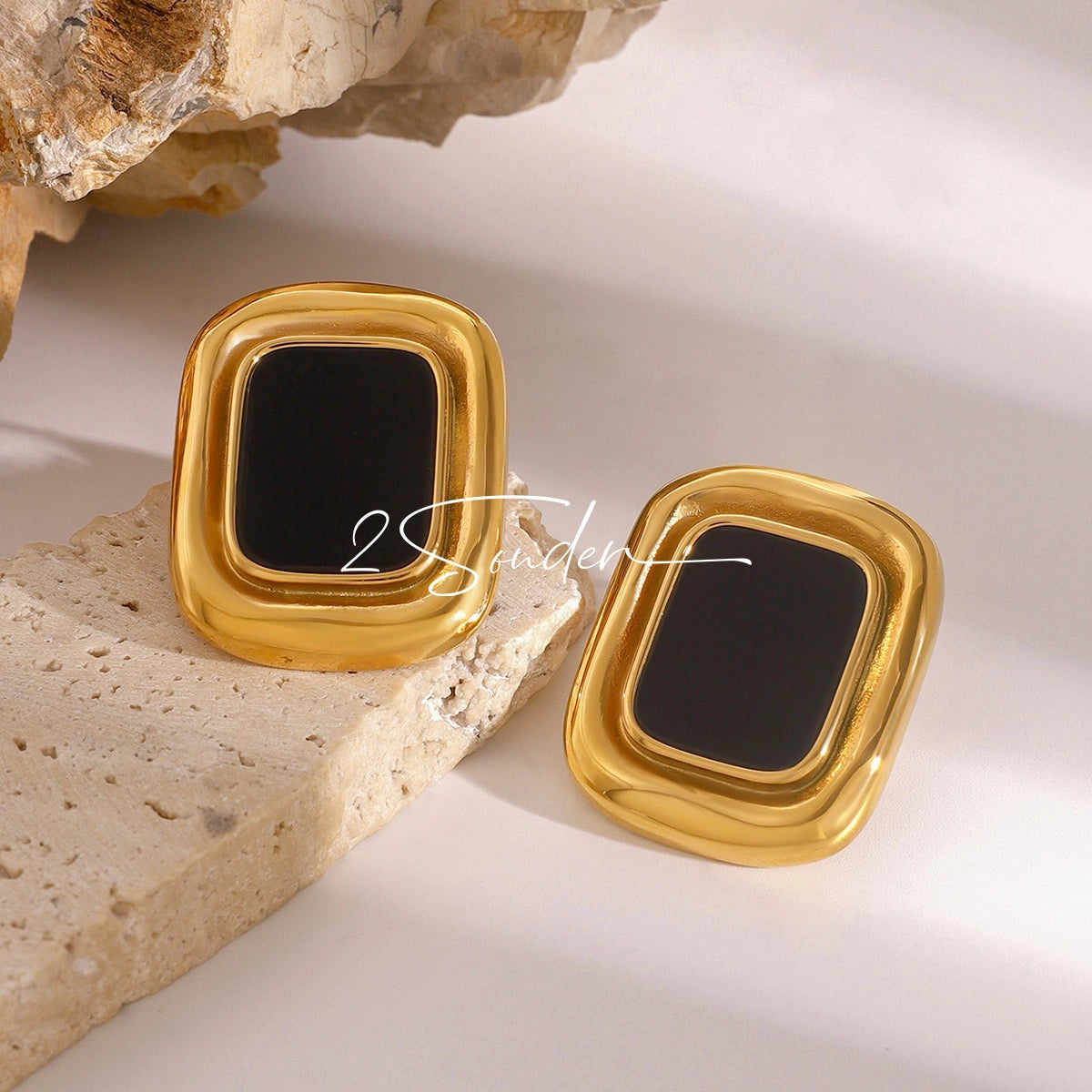 Classic Black and Gold Stud Earrings with Geometric Shape.