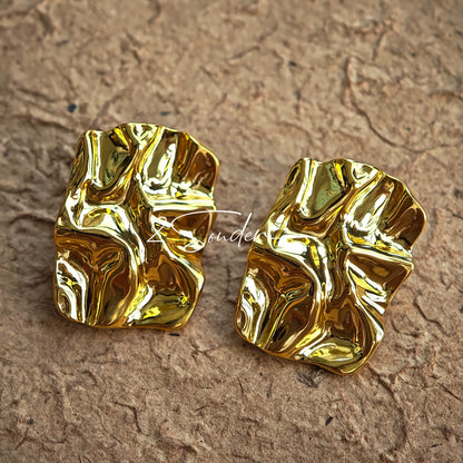 Classic Black and Gold Stud Earrings with Geometric Shape.