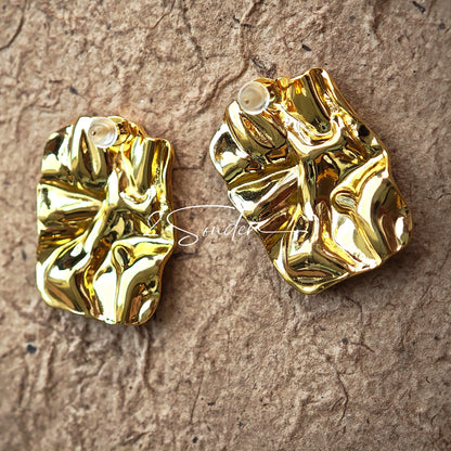 Classic Black and Gold Stud Earrings with Geometric Shape.