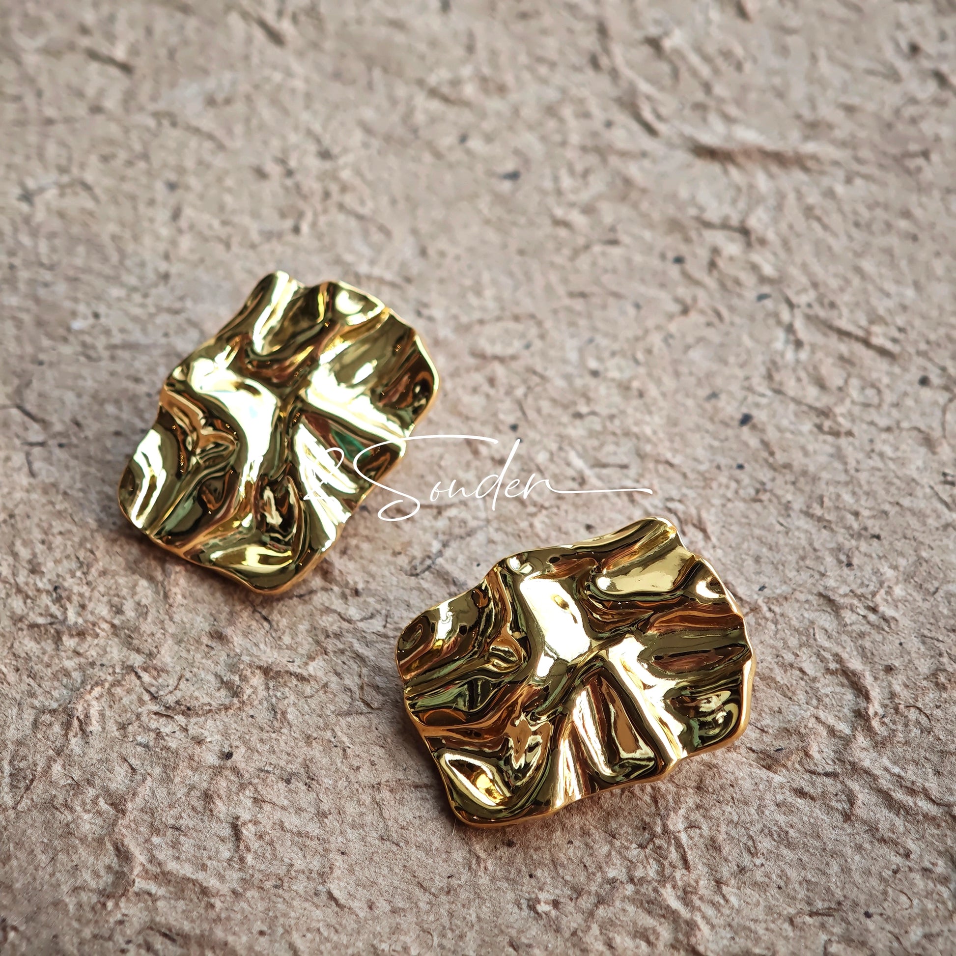 Classic Black and Gold Stud Earrings with Geometric Shape.