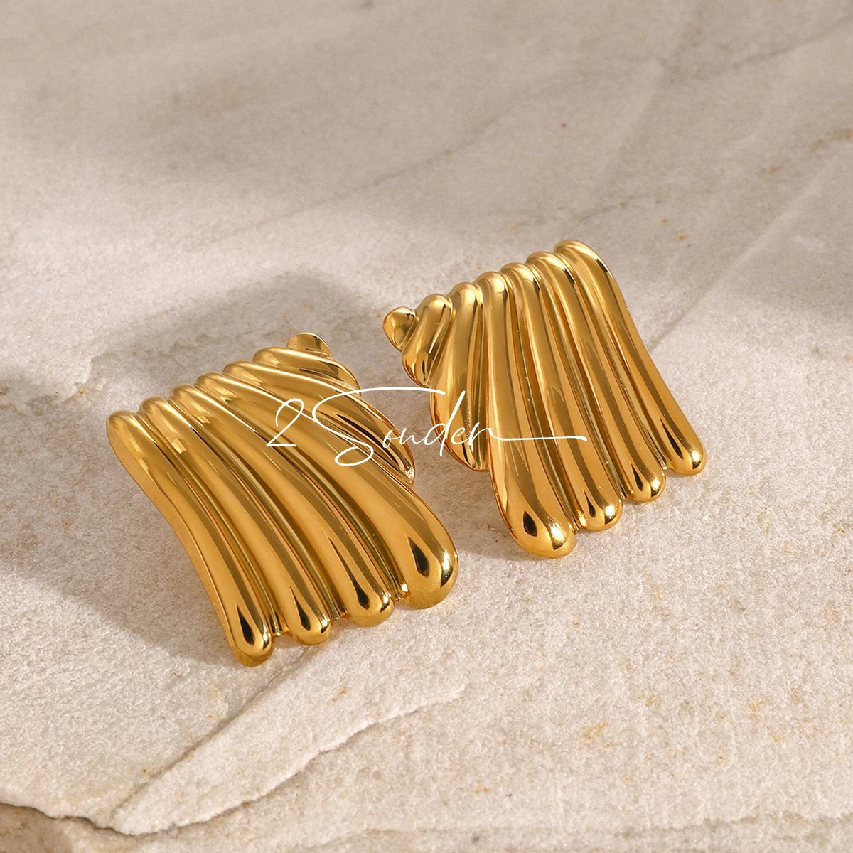 Classic Black and Gold Stud Earrings with Geometric Shape.
