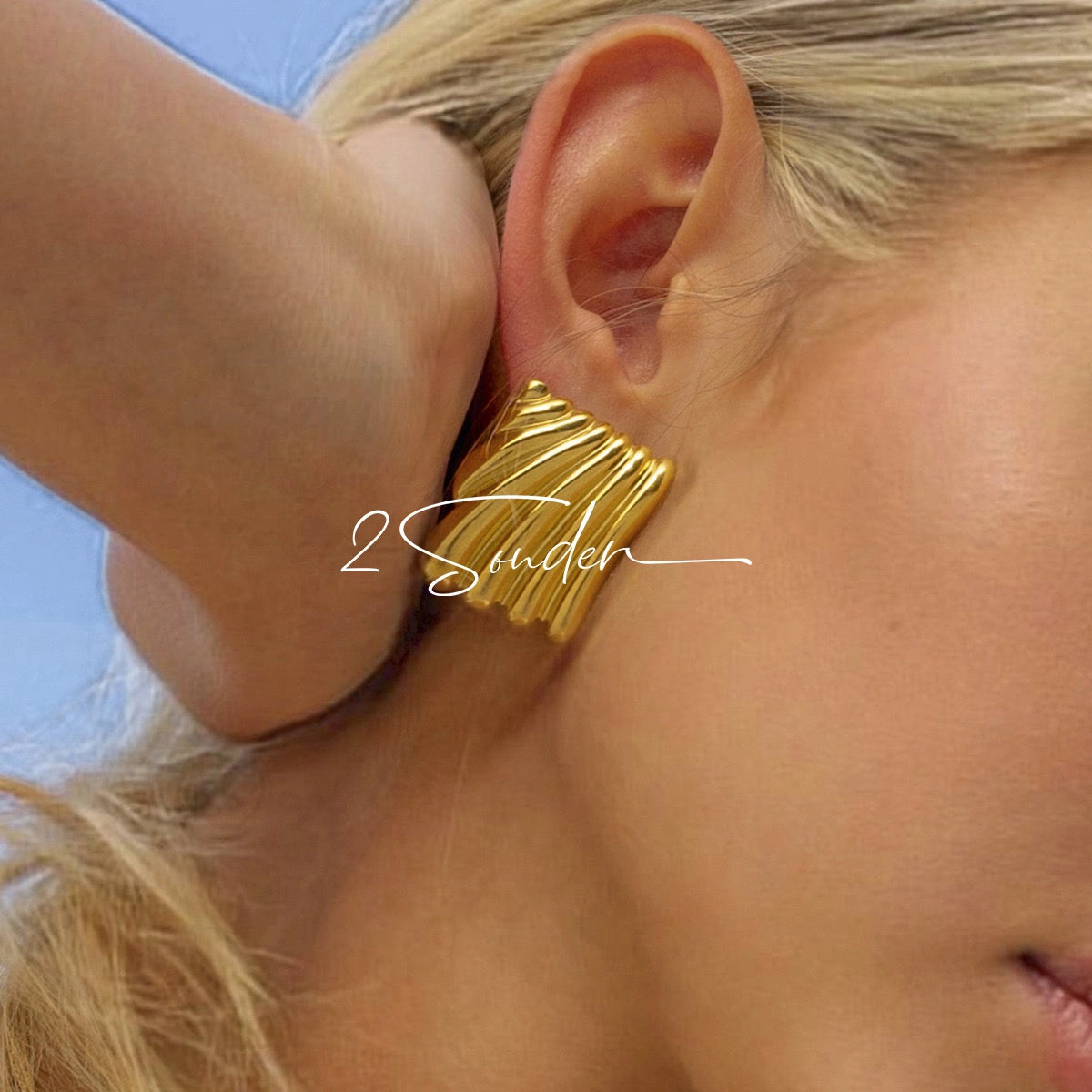 Classic Black and Gold Stud Earrings with Geometric Shape.