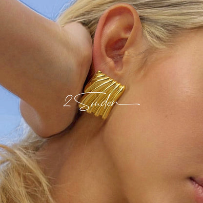 Classic Black and Gold Stud Earrings with Geometric Shape.