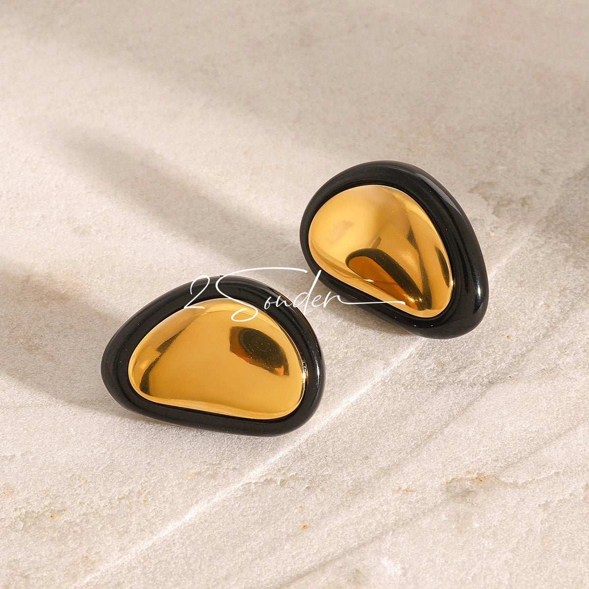 Classic Black and Gold Stud Earrings with Geometric Shape.