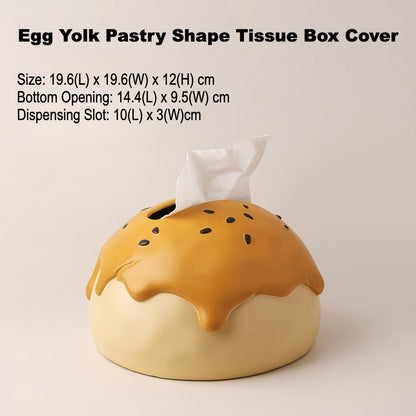 This is tissue box cover with an egg yolk pastry shape. On the lifelike flaky pstry surface, there are sesame seeds and a wide enough opening for pulling out tissues.