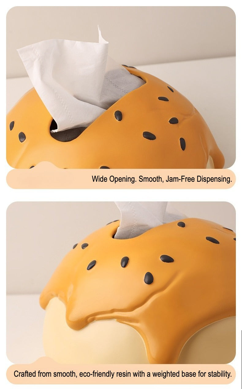 This is tissue box cover with an egg yolk pastry shape. On the lifelike flaky pstry surface, there are sesame seeds and a wide enough opening for pulling out tissues.