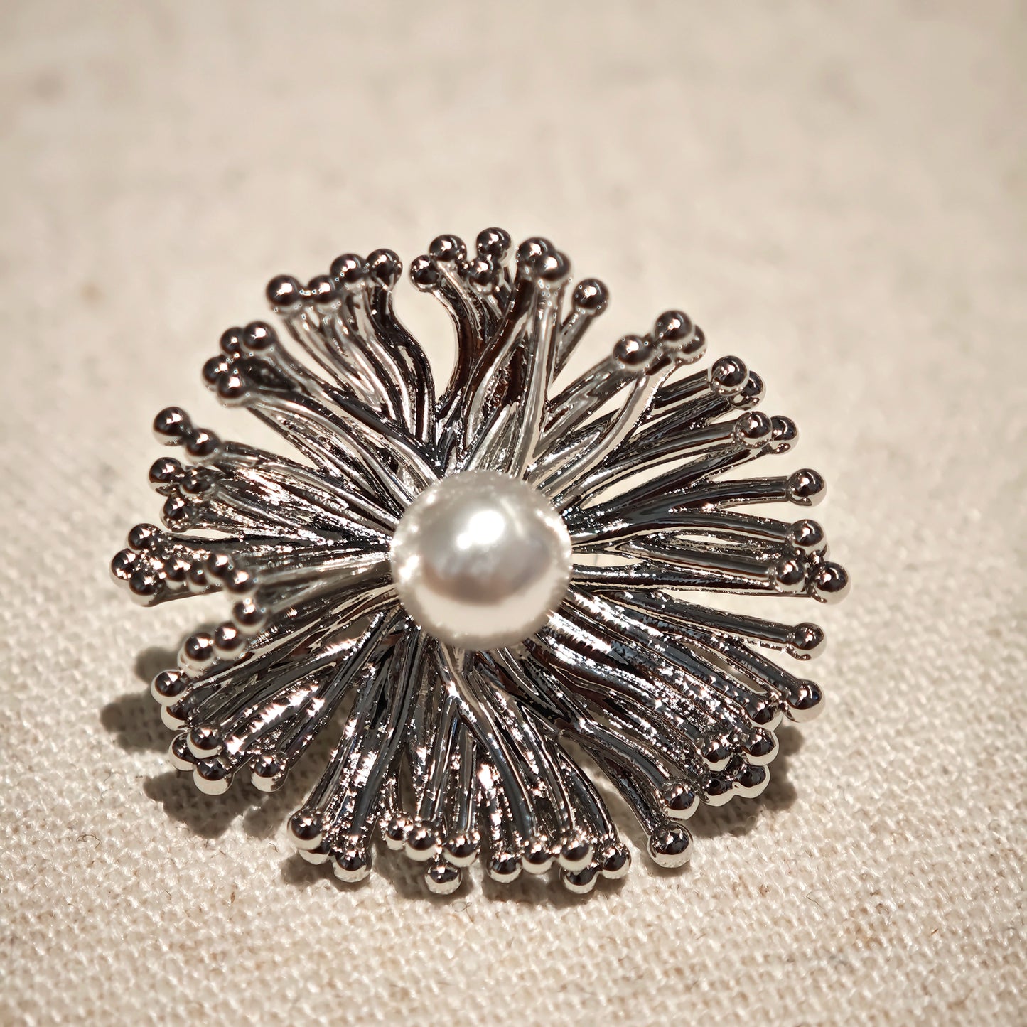 These earrings perfectly blend delicate flowers with lustrous pearls, exuding timeless romance and adding an elegant touch to any outfit.