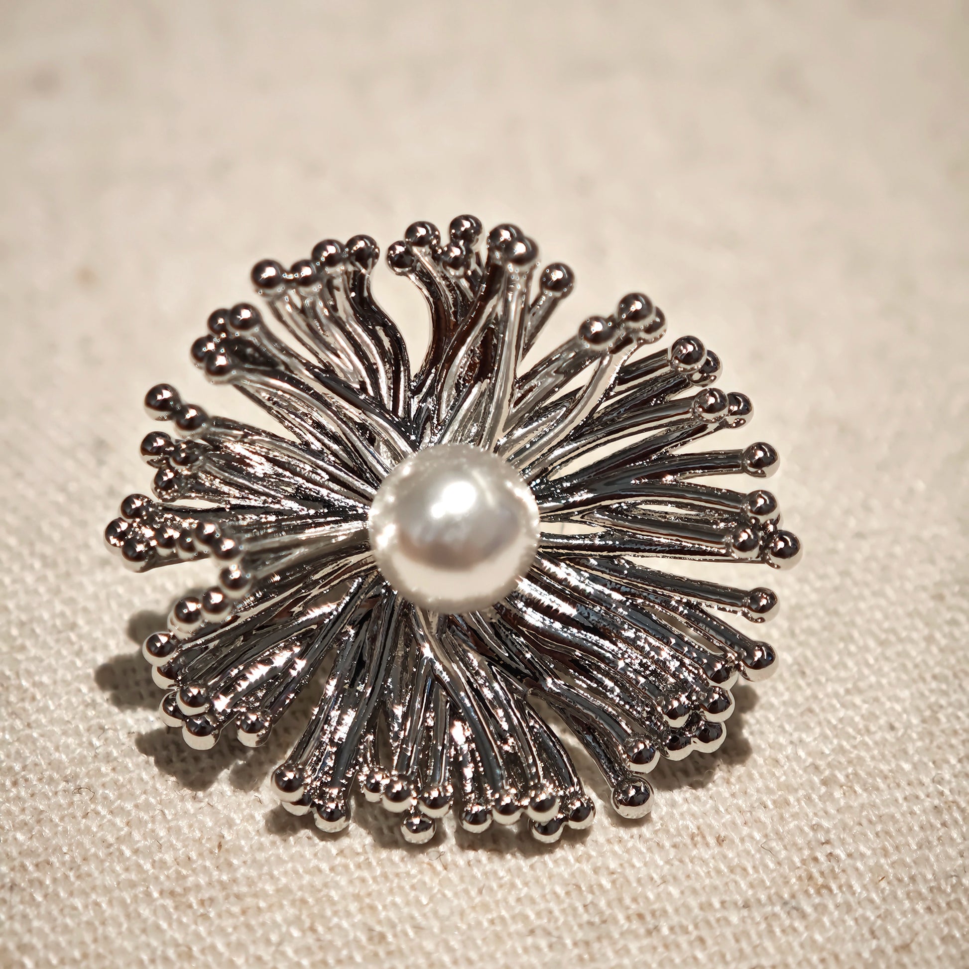 These earrings perfectly blend delicate flowers with lustrous pearls, exuding timeless romance and adding an elegant touch to any outfit.