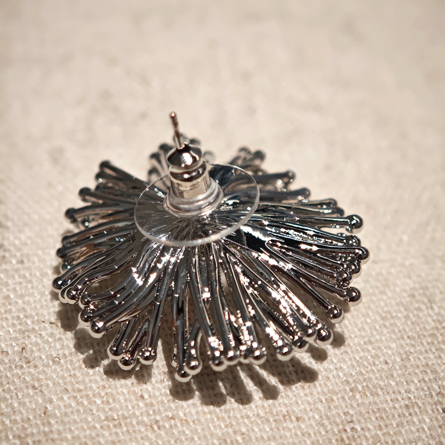 These earrings perfectly blend delicate flowers with lustrous pearls, exuding timeless romance and adding an elegant touch to any outfit.