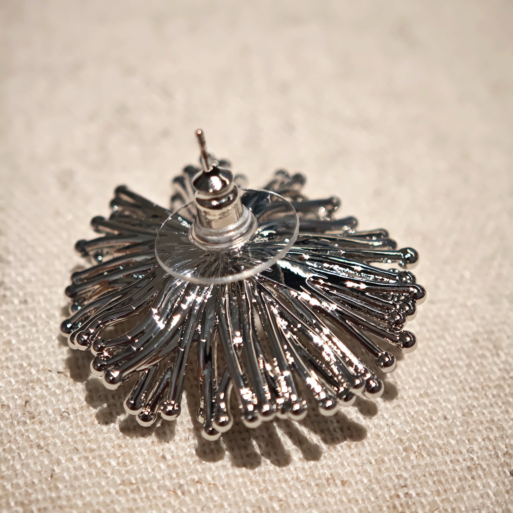 These earrings perfectly blend delicate flowers with lustrous pearls, exuding timeless romance and adding an elegant touch to any outfit.