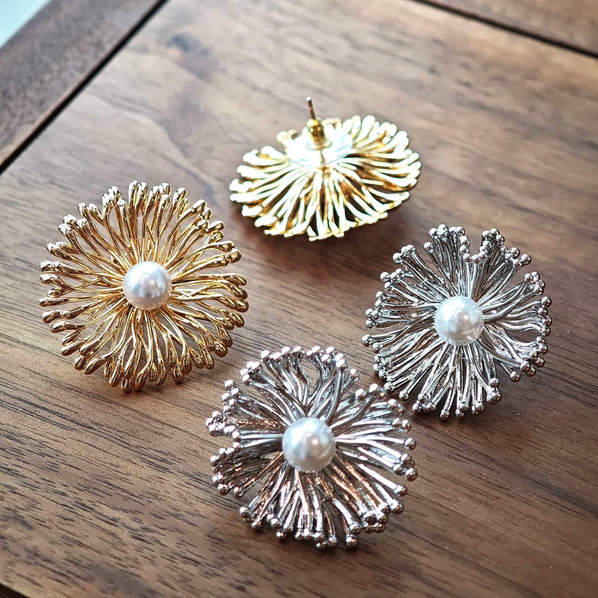 These earrings perfectly blend delicate flowers with lustrous pearls, exuding timeless romance and adding an elegant touch to any outfit.