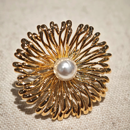 These earrings perfectly blend delicate flowers with lustrous pearls, exuding timeless romance and adding an elegant touch to any outfit.