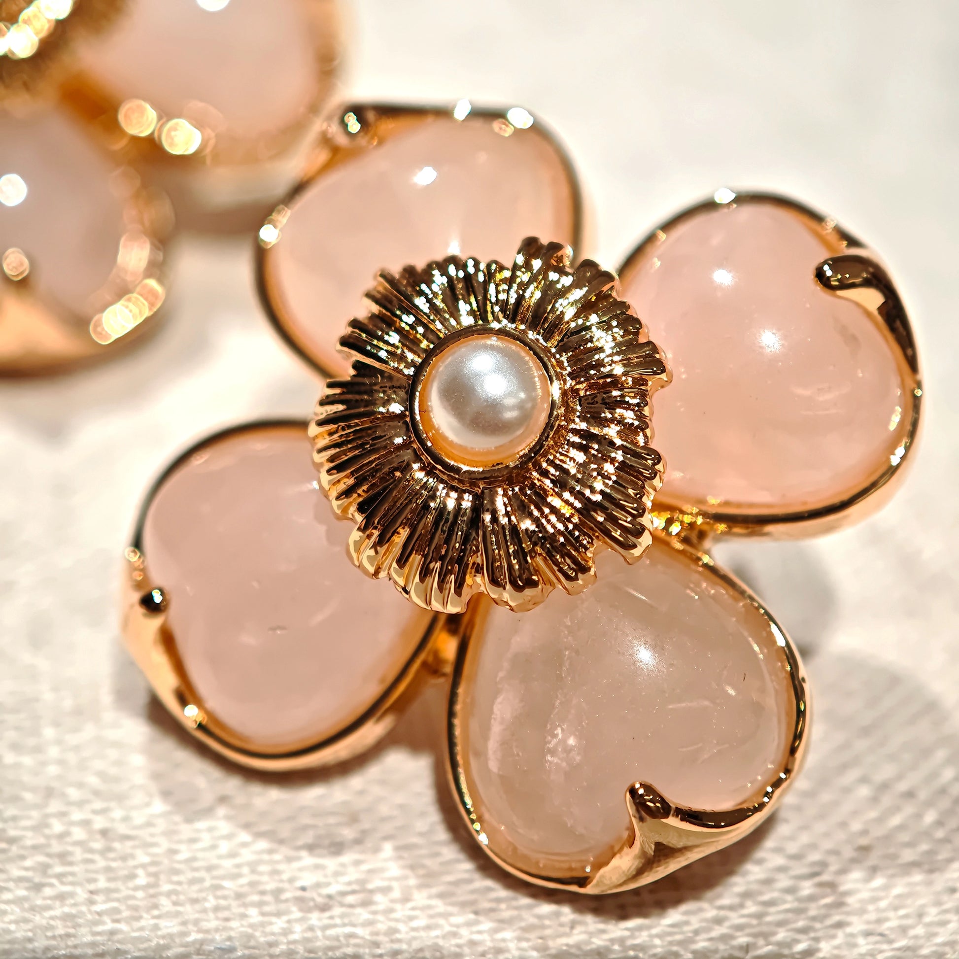 This is a pair of pink earrings made of recycled copper and ethically sourced natural stones. The size of each piece of earring is 3.7x3.7cm.