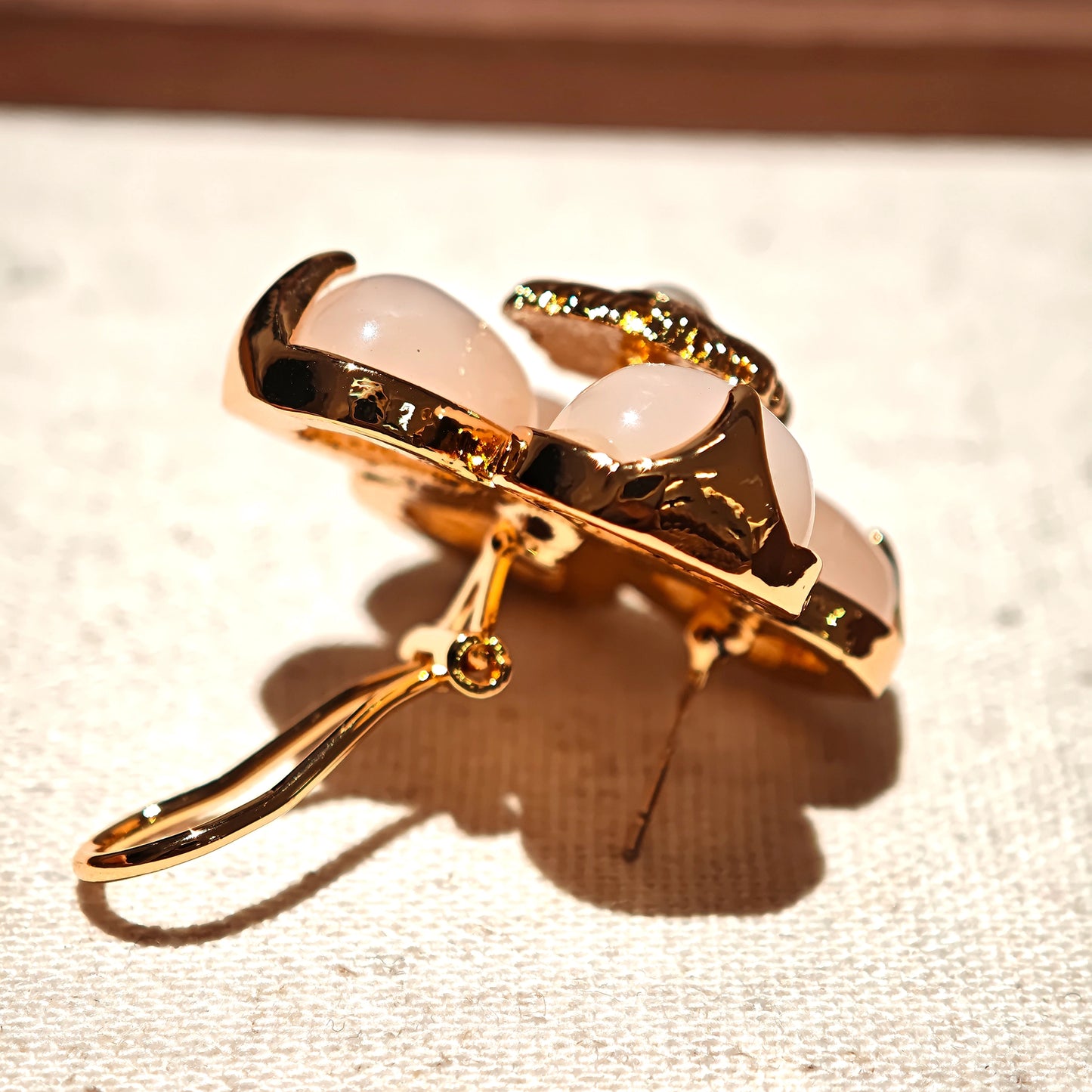 This is a pair of pink earrings made of recycled copper and ethically sourced natural stones. The size of each piece of earring is 3.7x3.7cm.