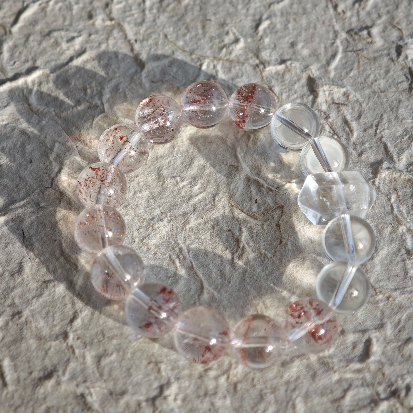 This is a golden strawberry quartz and Clear Quartz bracelet, with unique transparency and elegance.