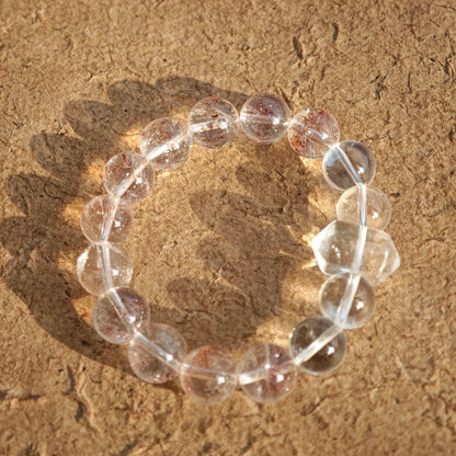 This is a golden strawberry quartz and Clear Quartz bracelet, with unique transparency and elegance.