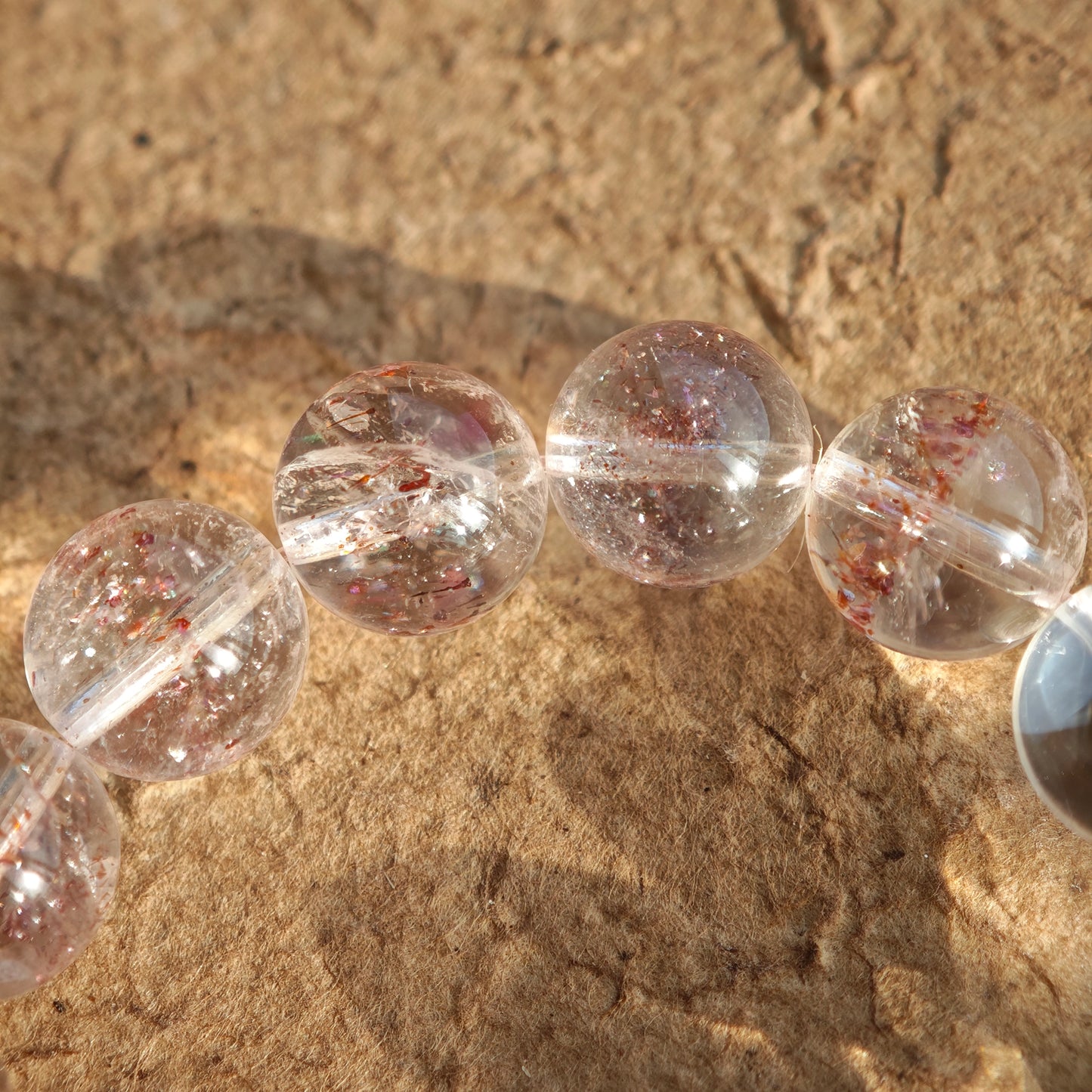 This is a golden strawberry quartz and Clear Quartz bracelet, with unique transparency and elegance.