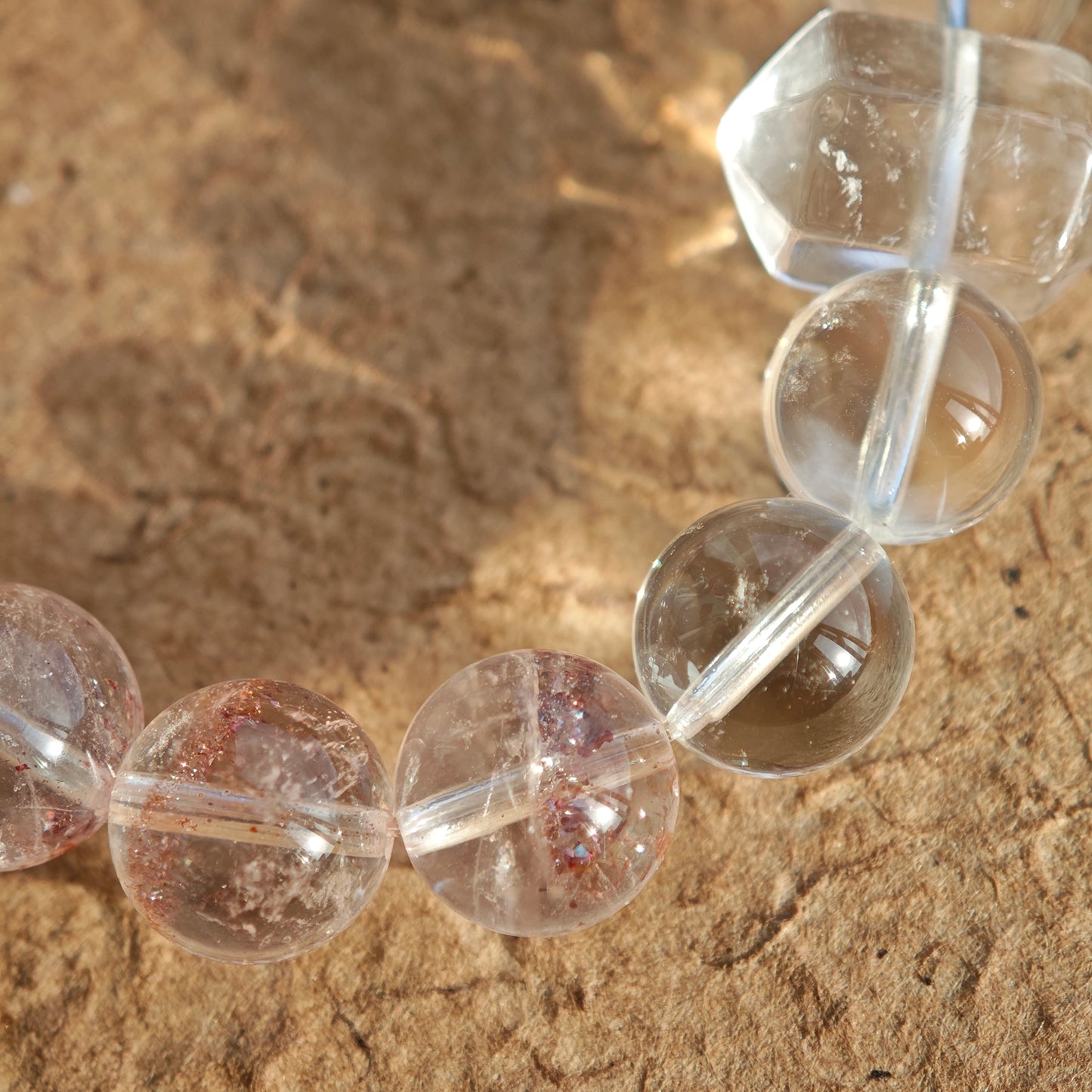 This is a golden strawberry quartz and Clear Quartz bracelet, with unique transparency and elegance.
