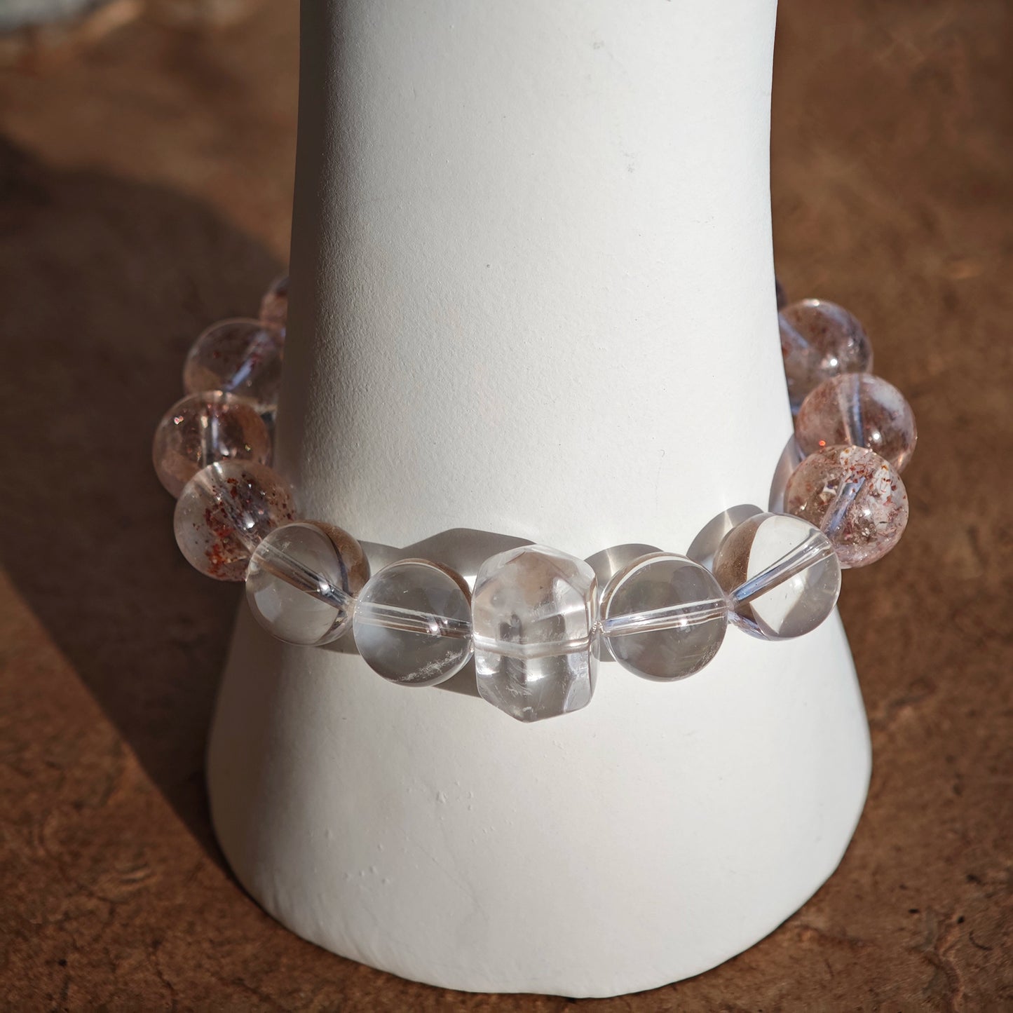 This is a golden strawberry quartz and Clear Quartz bracelet, with unique transparency and elegance.